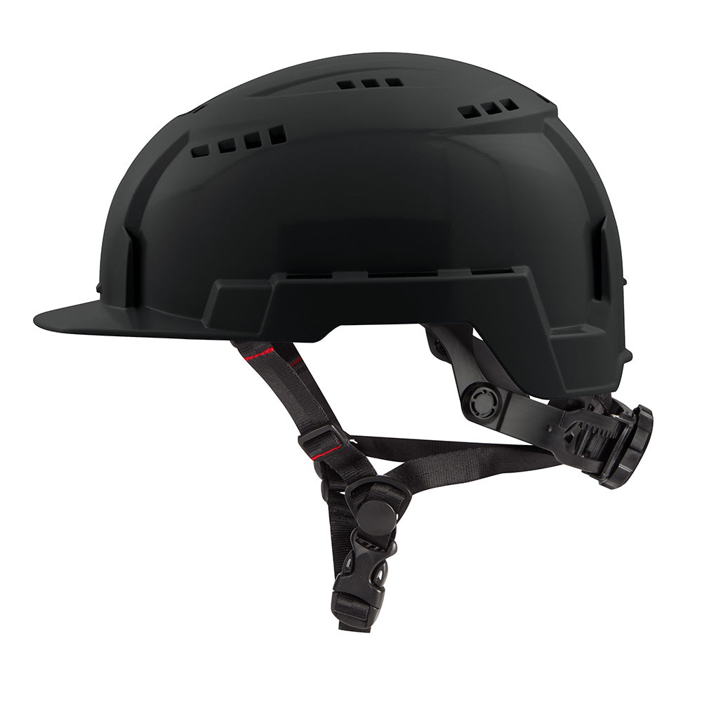 Black vented safety helmet with front brim, chin straps, and side ventilation slots.