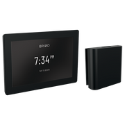 Matte black digital steam shower control with touchscreen display showing 7:34 PM and separate remote control unit.