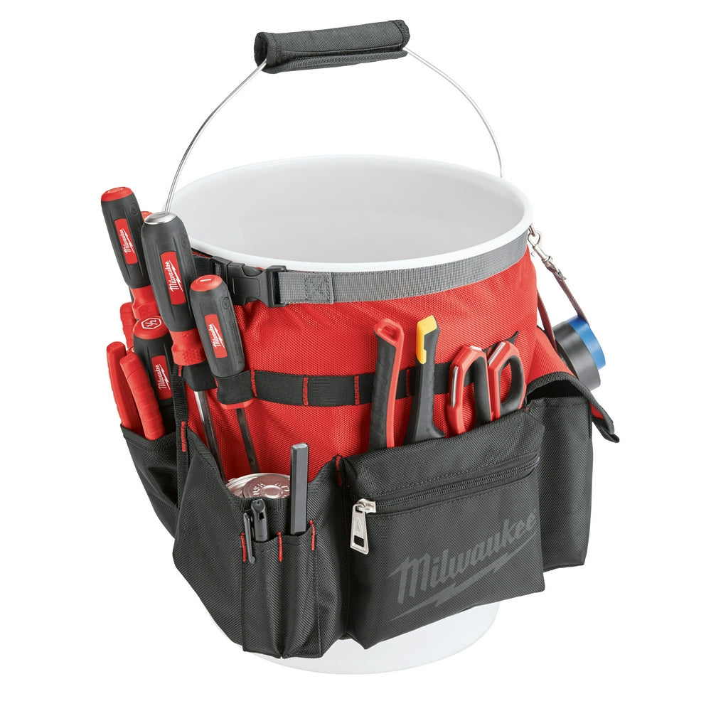 Red and black bucket organizer with multiple pockets holding various hand tools and a metal bucket handle with padded grip.