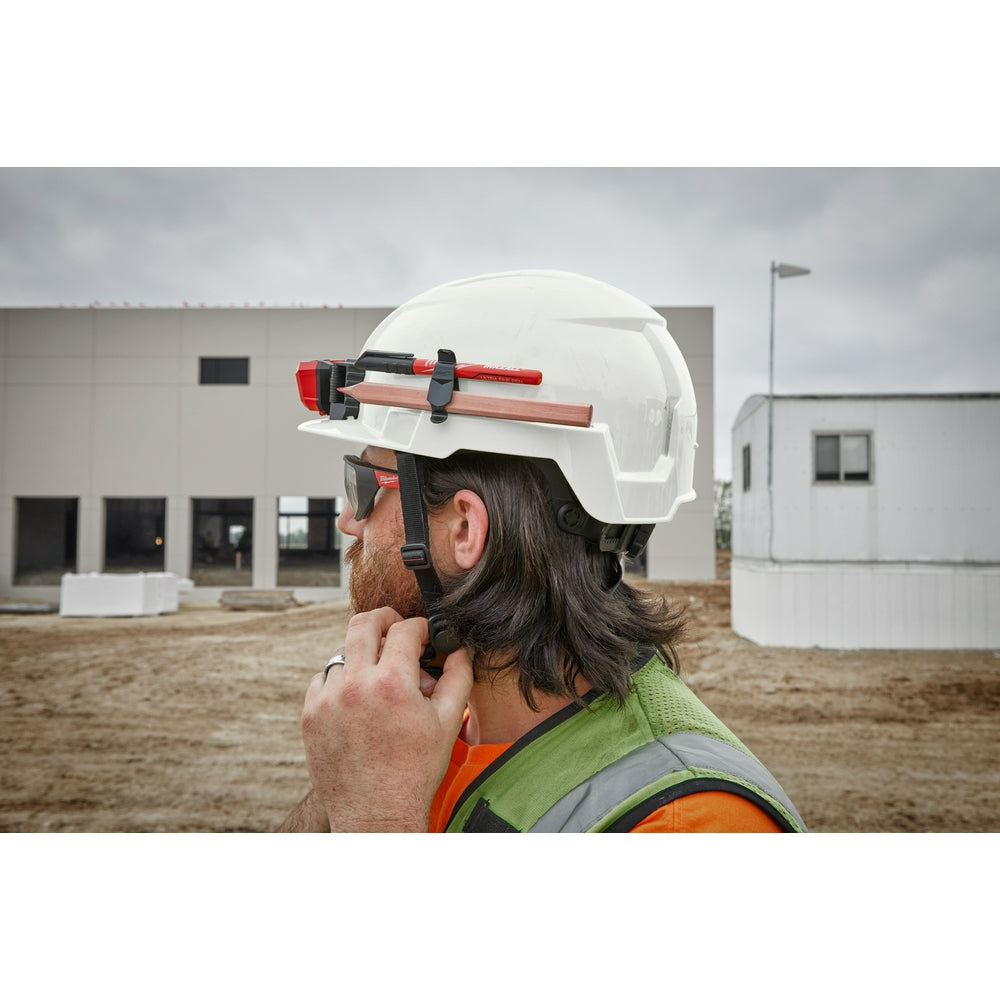 Gray hard hat with front brim and red BOLT tool attachment, shown from side view on wearer.