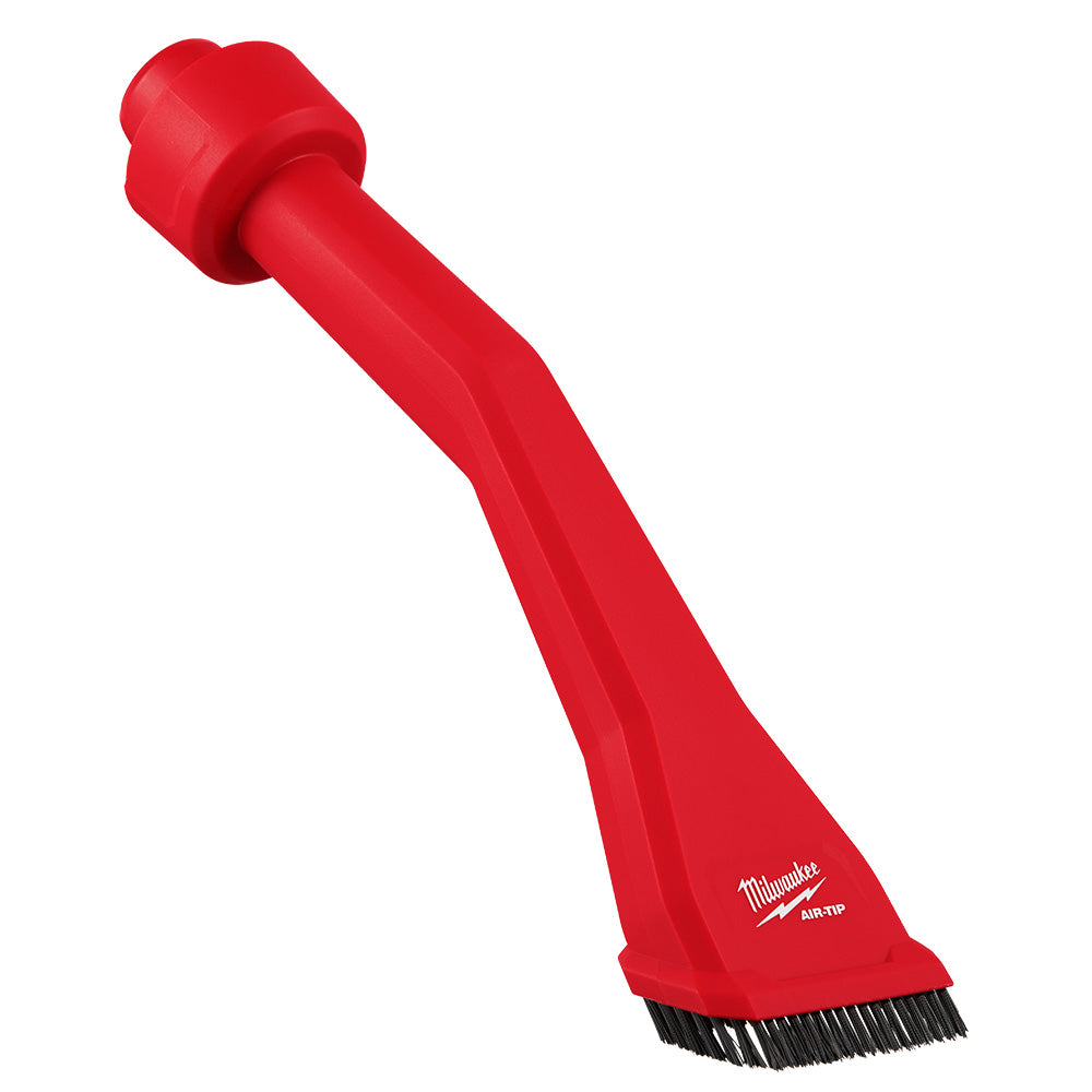 Red utility nozzle with claw-shaped head and integrated brush bristles at the base.