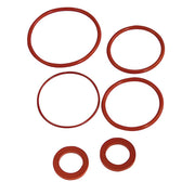 Six red rubber O-rings in varying sizes arranged on white background.