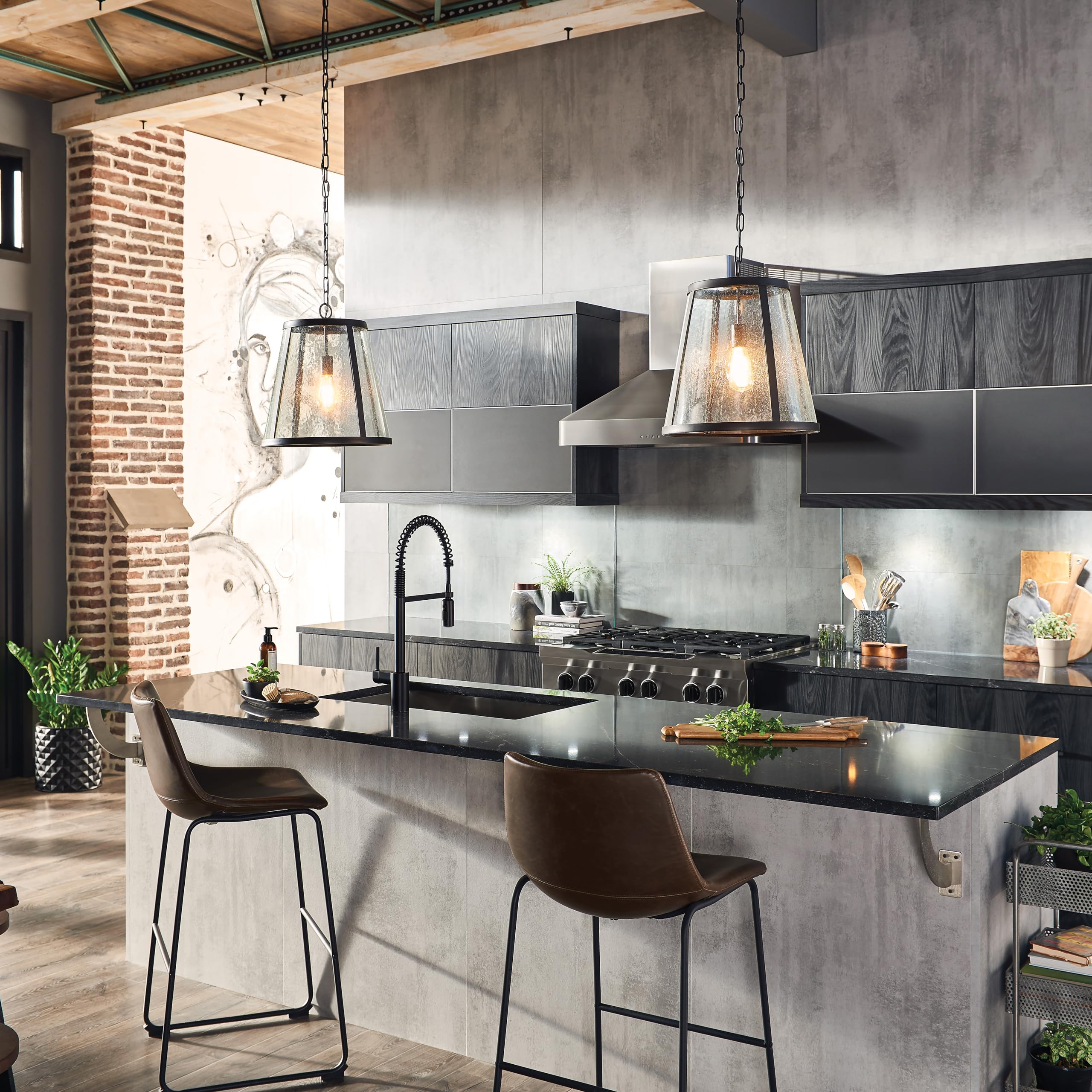 Matte black single-hole kitchen faucet with pulldown sprayer installed above sink in modern kitchen.