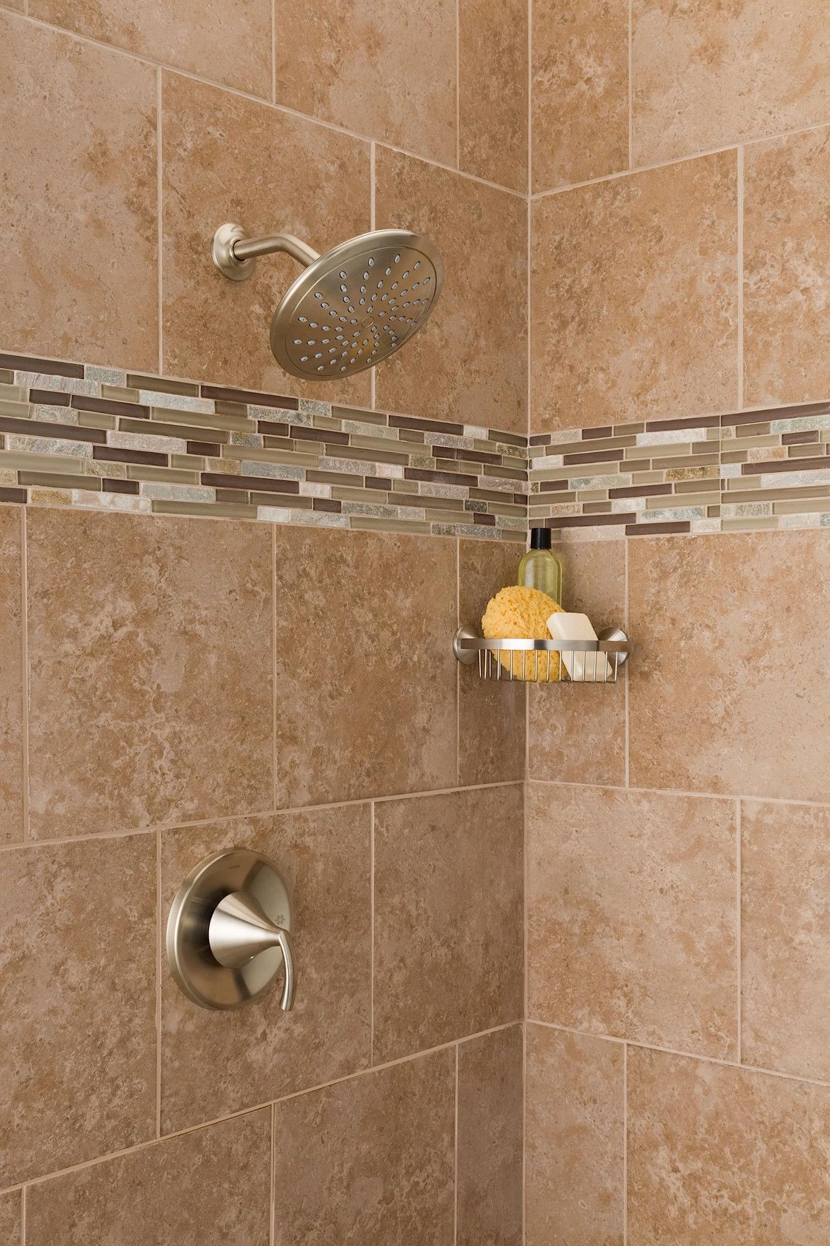 Brushed nickel 8-inch round rain shower head mounted on tile wall with matching valve trim below.