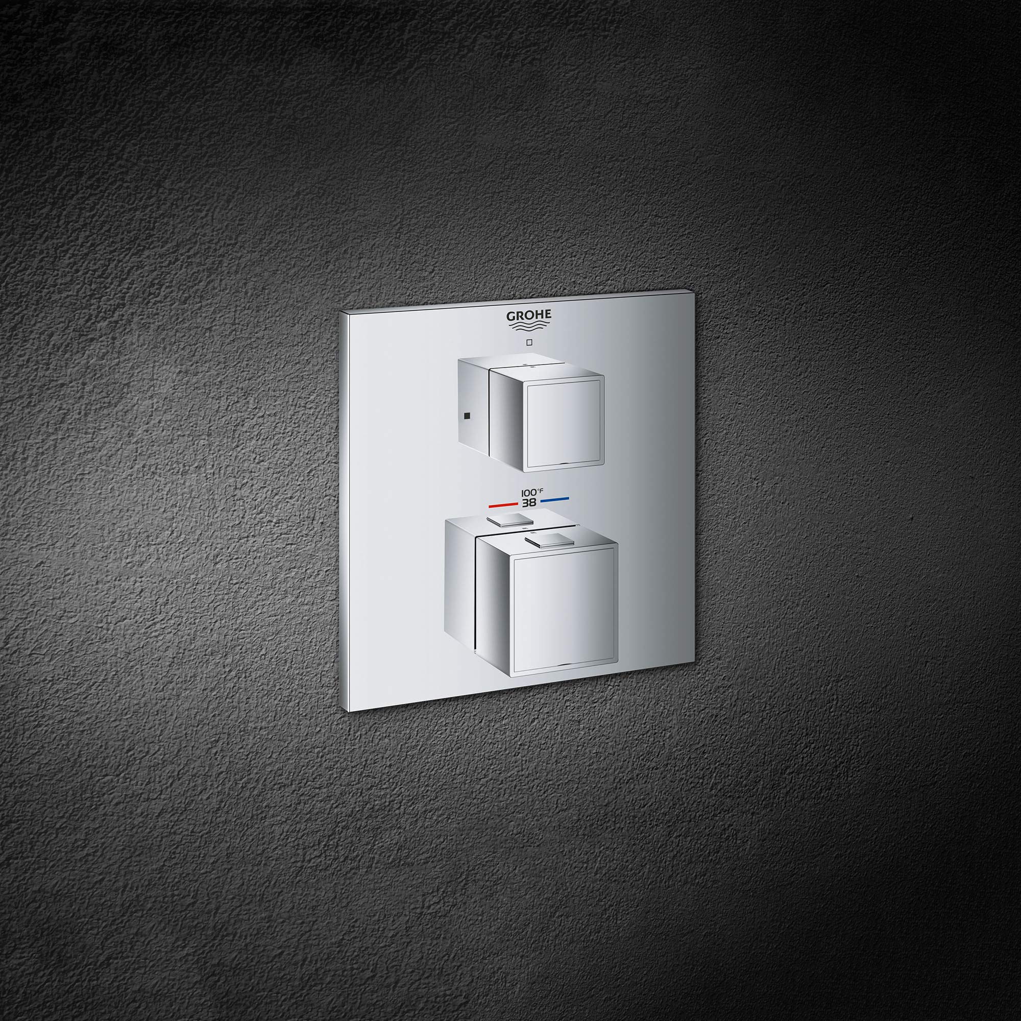 Grohe Grohtherm thermostatic valve trim with two square chrome handles and temperature dial mounted on white escutcheon plate