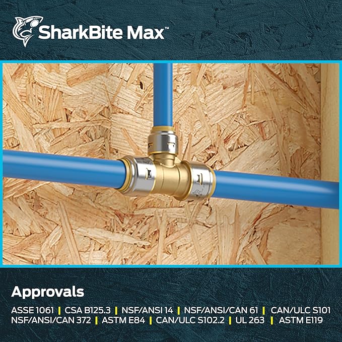 Brass reducing tee fitting connected to blue PEX tubing on wooden background.