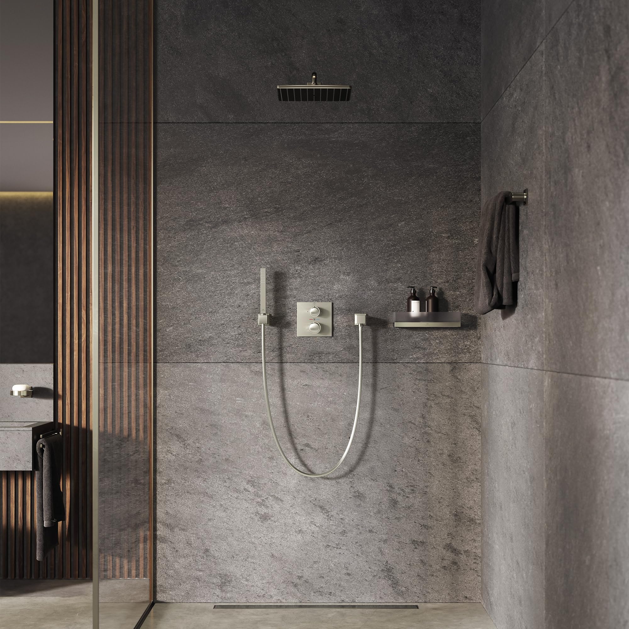 Brushed nickel dual-handle thermostatic valve trim with handheld shower head and wall-mounted spout installed in gray tile sh