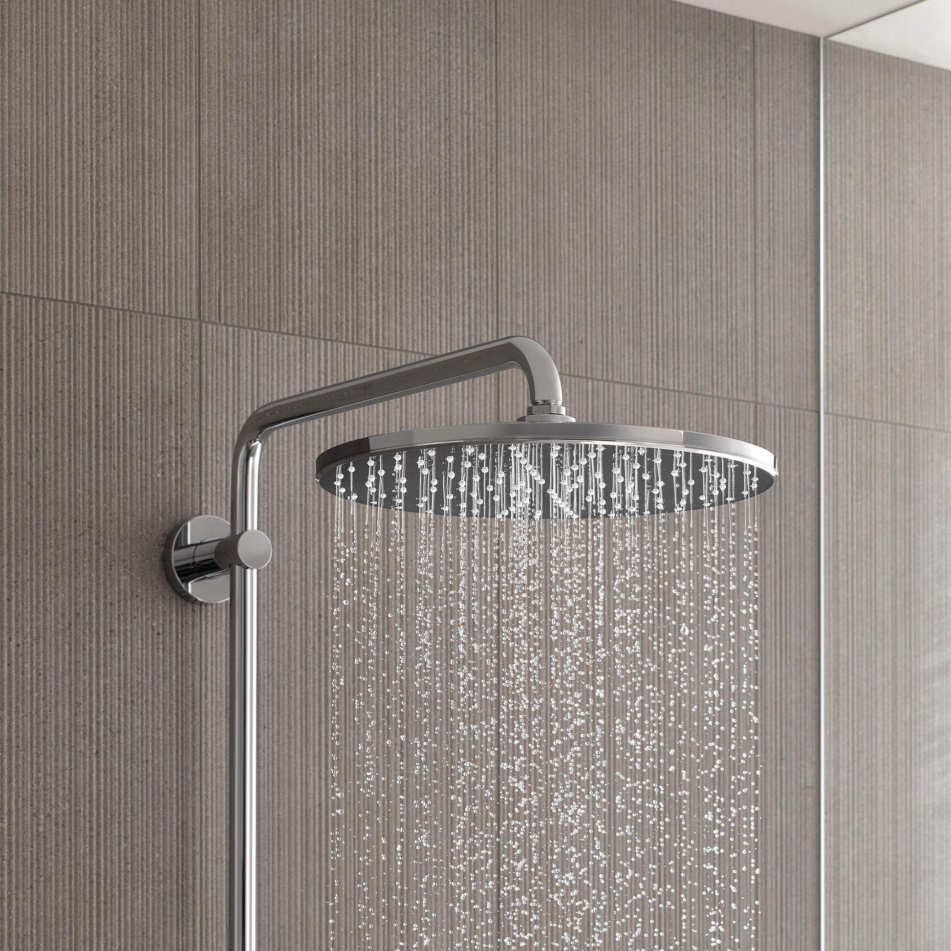 Chrome thermostatic shower system with round overhead showerhead and wall-mounted control valve.