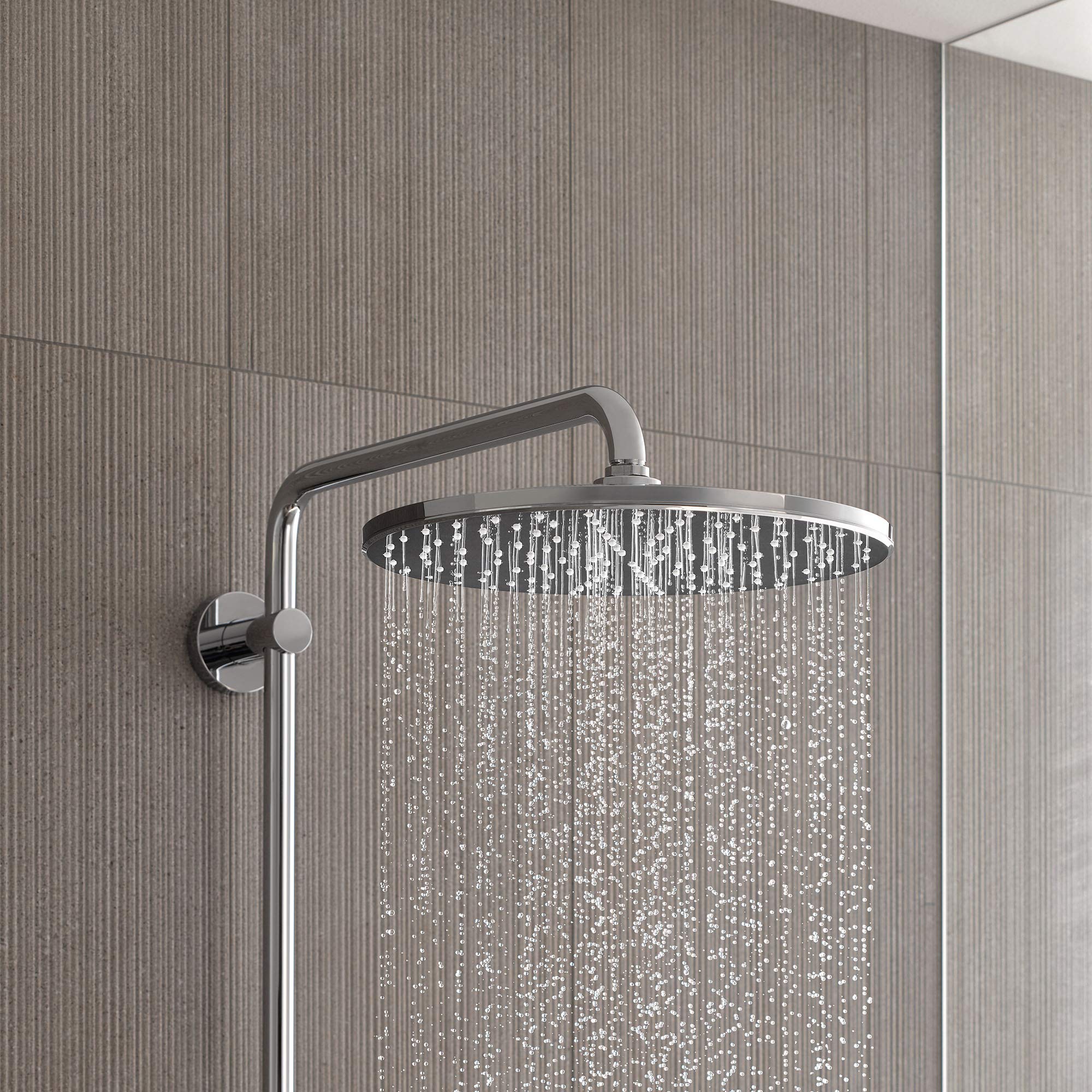 Chrome thermostatic shower system with round overhead showerhead and wall-mounted control valve.