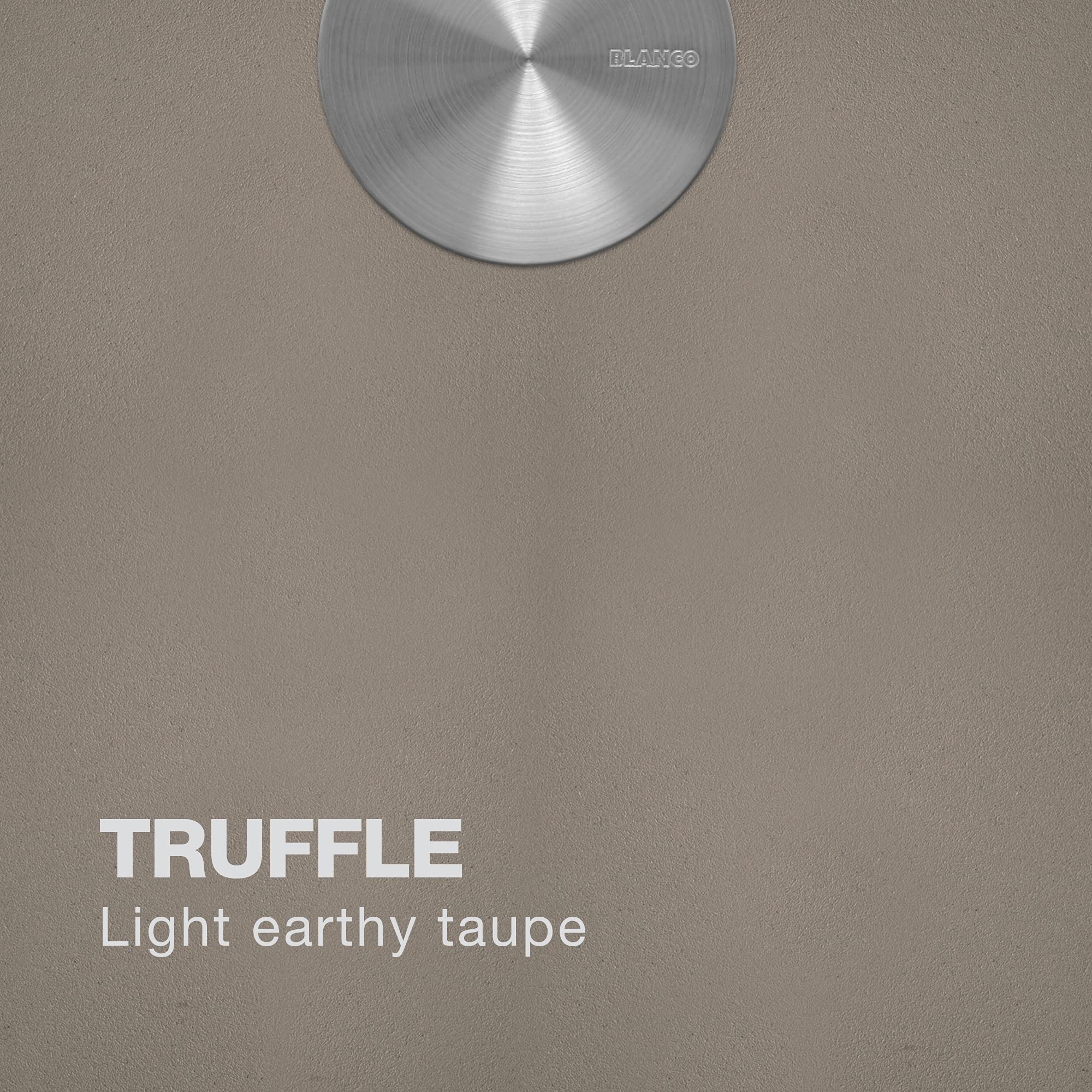 Truffle-colored sink surface with brushed metal drain opening visible at top.