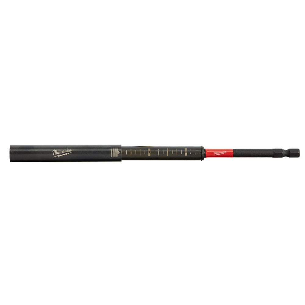 Black Milwaukee Shockwave impact magnetic drive guide with measurement markings and red hex bit end.
