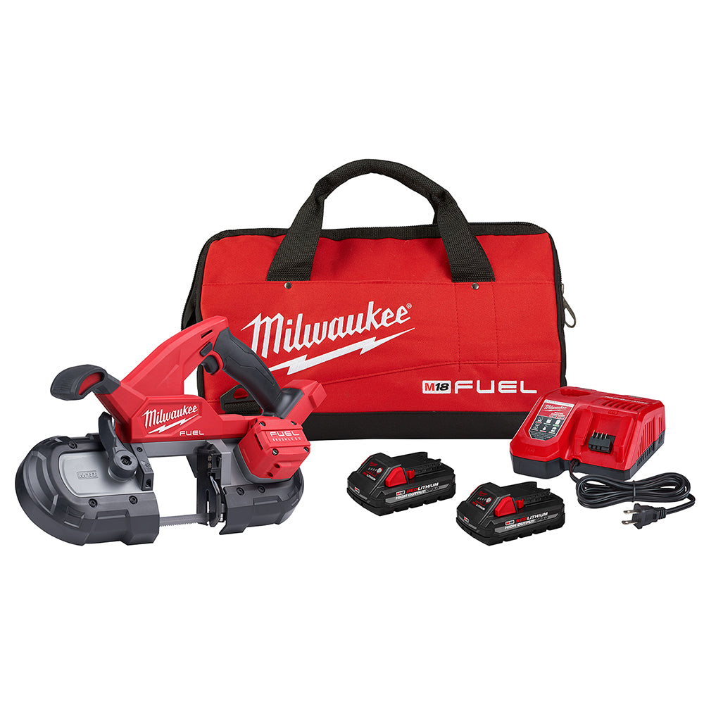 Milwaukee M18 FUEL compact band saw kit with red carrying bag, two batteries, charger, and power cord.