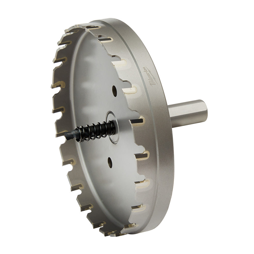 Carbide hole cutter with gray cylindrical body, toothed cutting edge, center arbor, and spring-loaded pilot bit.