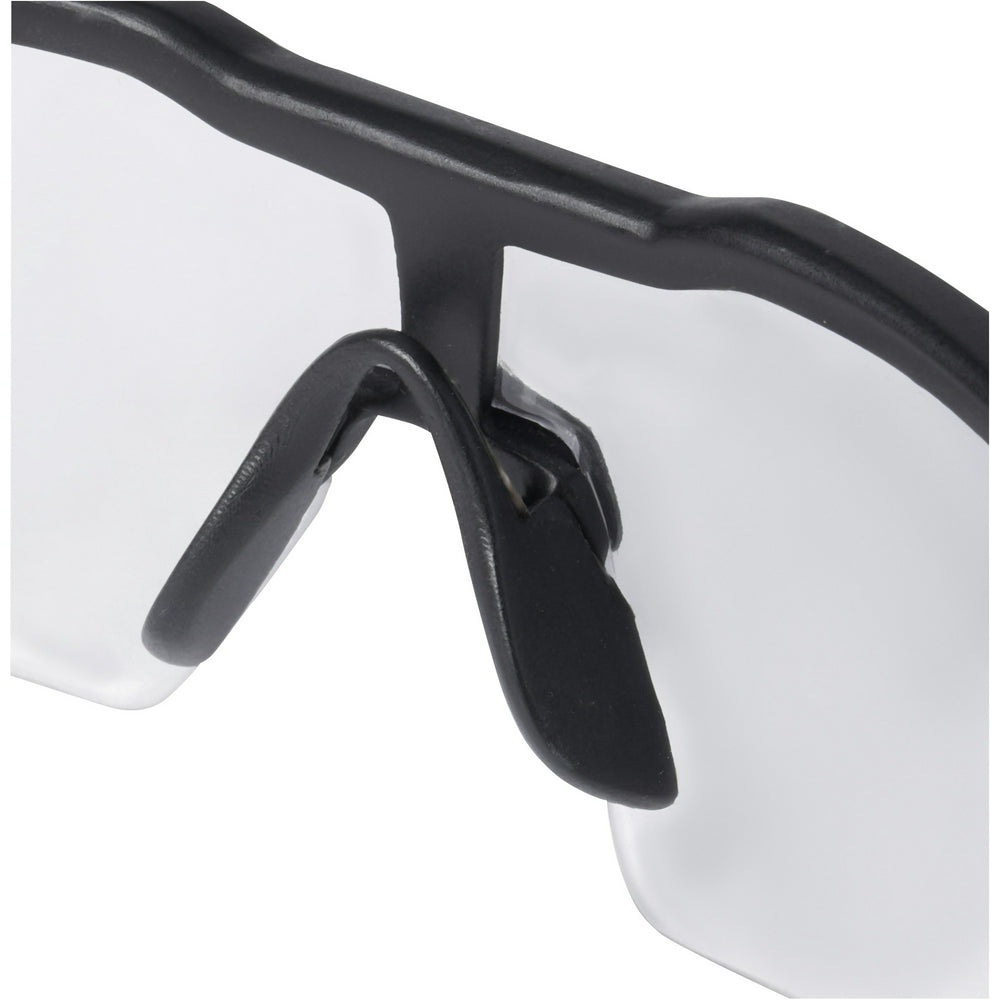 Safety glasses with clear lenses and black frame featuring adjustable temple arms.