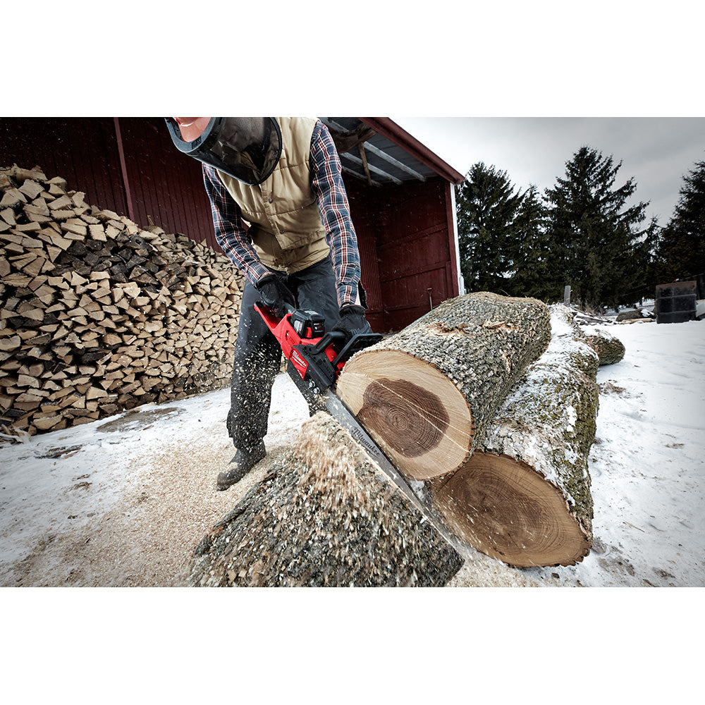Milwaukee 16" chainsaw guide bar attached to red chainsaw cutting through a log outdoors.