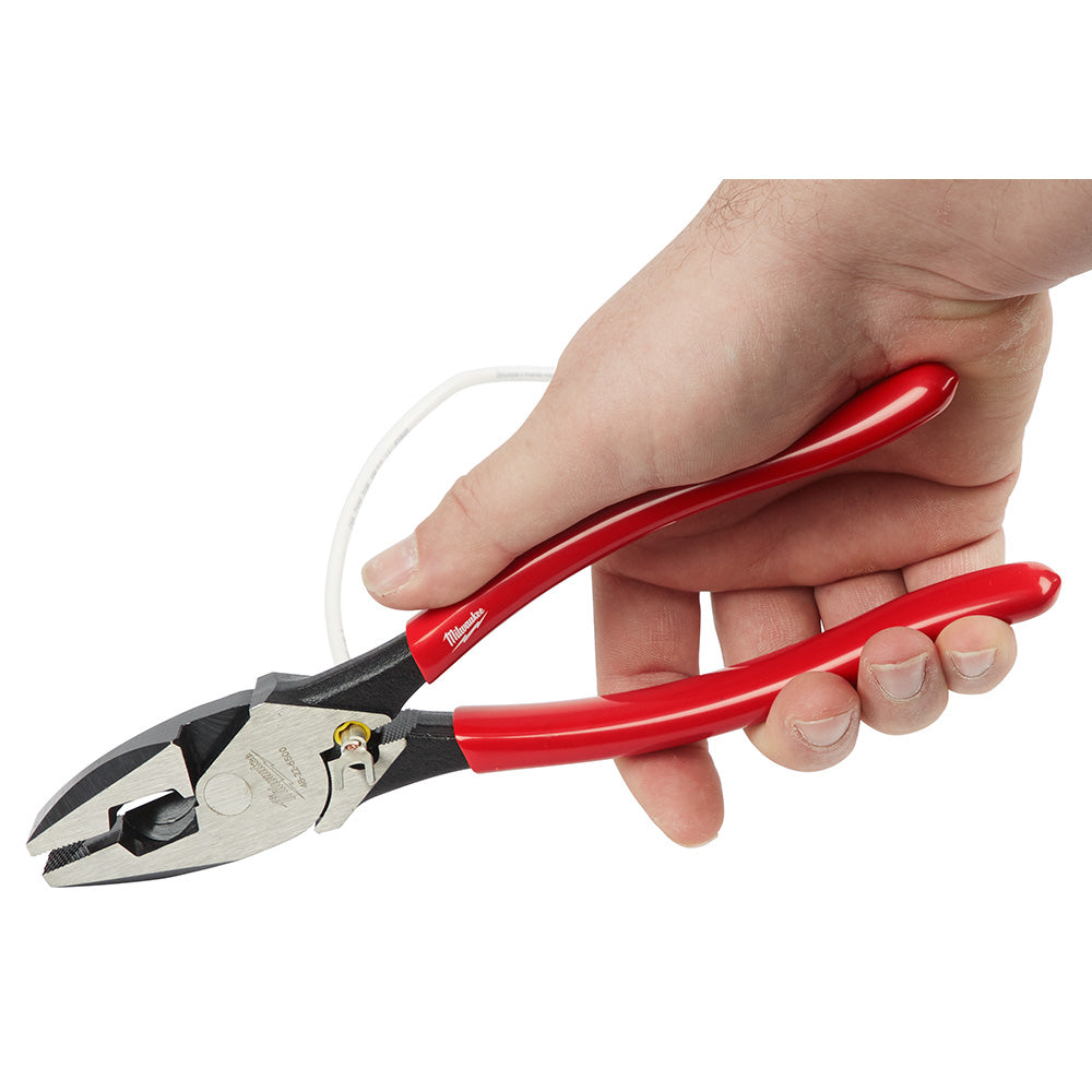 Linesman's pliers with red dipped handles and metal jaws held in a hand, featuring a crimper tool.
