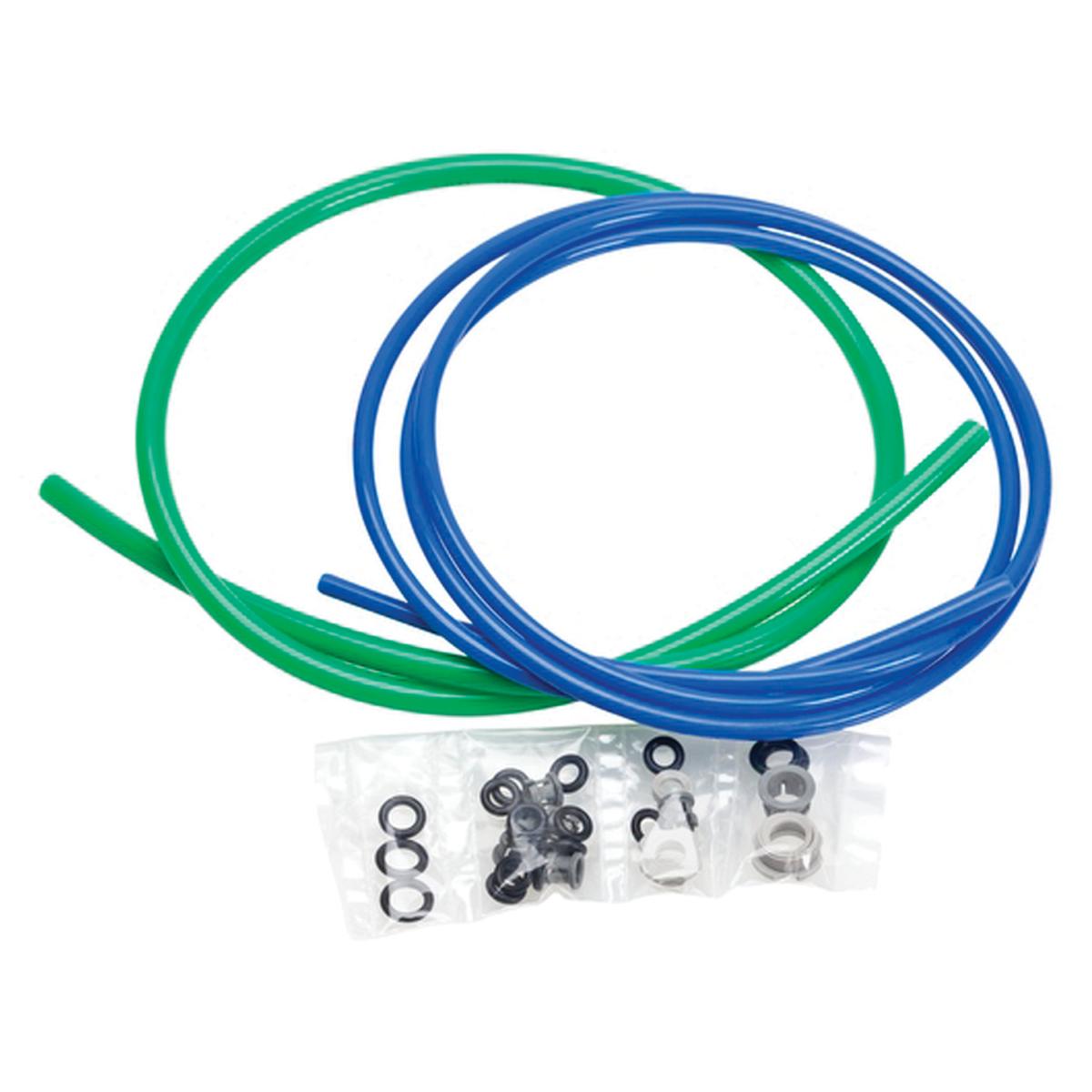 Green and blue tubing coils with assorted metal and rubber fittings in compartmented packaging.