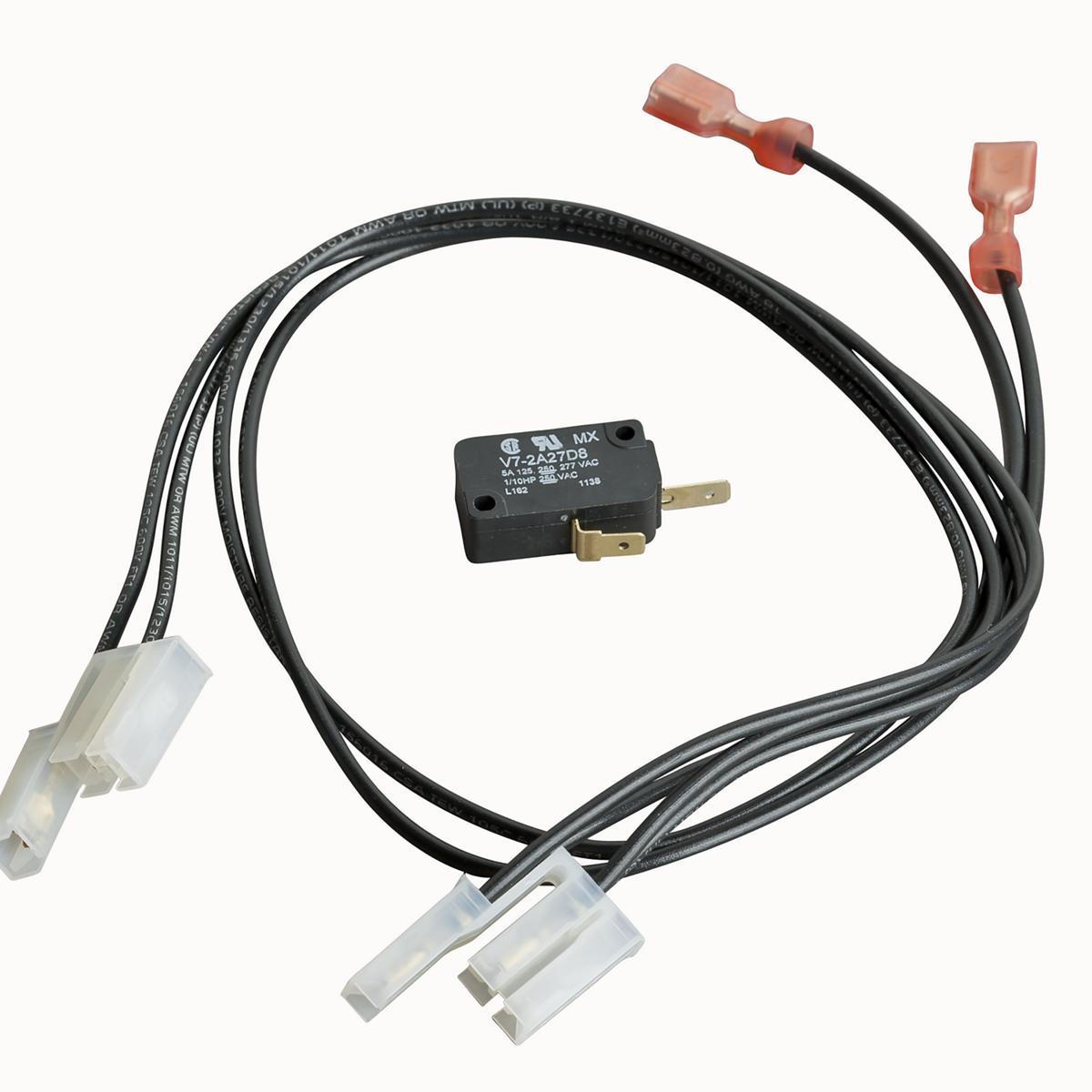 Black wiring harness with white connectors, red spade terminals, and small black electrical switch with brass contacts.