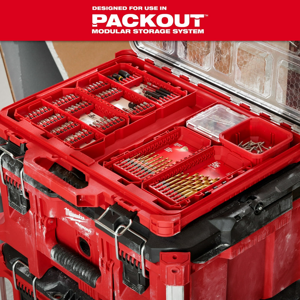 Red Milwaukee compact case with customizable compartments containing drill bits, impact driver bits, and fasteners, lid open 