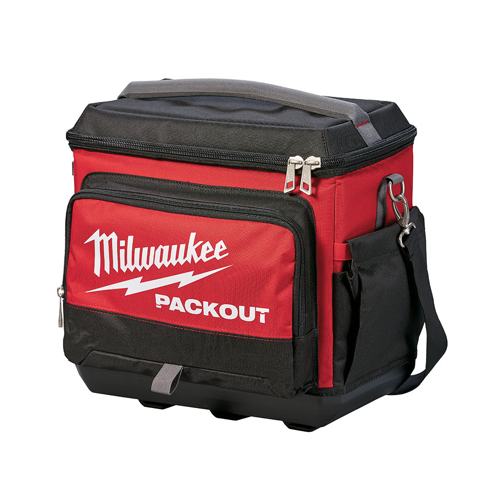 Red and black soft cooler with Milwaukee PACKOUT branding, dual handles, front pocket, and shoulder strap.