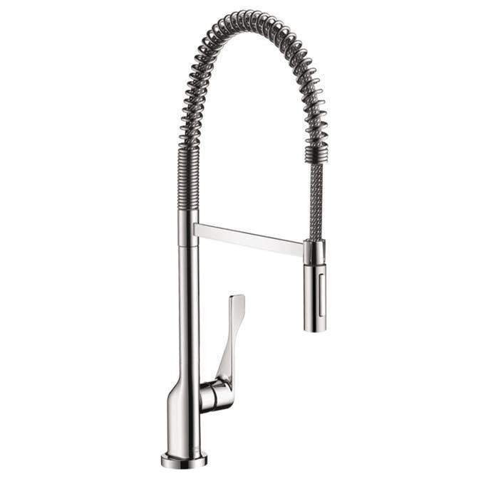 Chrome kitchen faucet with curved spout, coiled spray hose, and single lever handle.