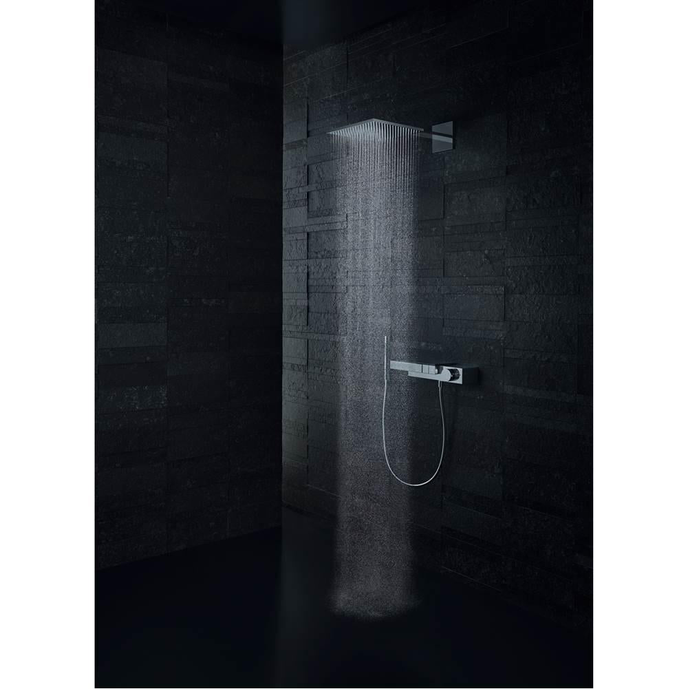 Polished black chrome handshower holder mounted on dark tile shower wall with connected hose and rainfall showerhead.