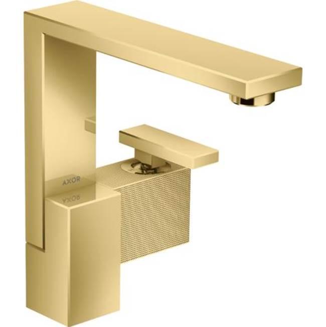 Polished gold single-hole bathroom faucet with geometric spout and textured base panel, angled view.
