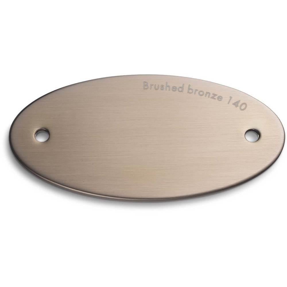 Brushed bronze finish sample chip with two mounting holes and embossed text label.