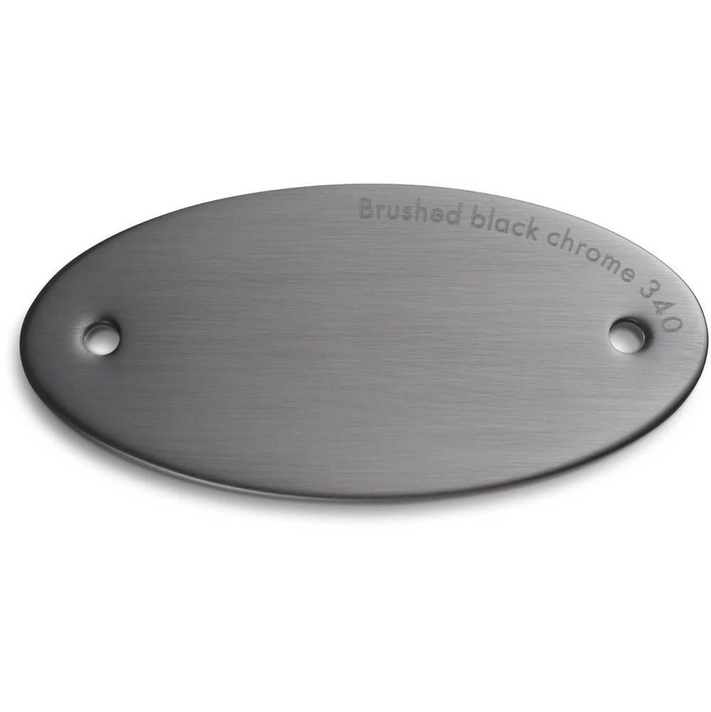 Brushed black chrome finish sample chip with two mounting holes and embossed text.