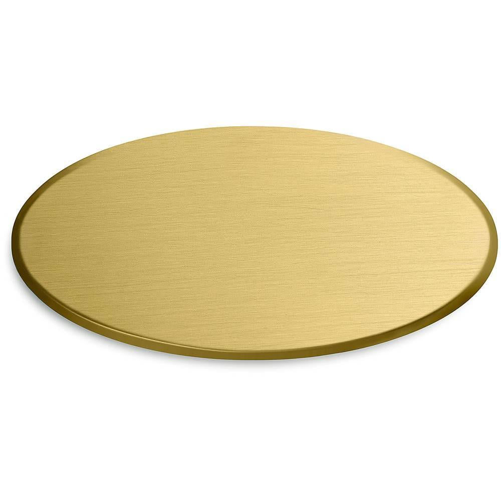 Oval brushed brass finish sample chip with textured surface and beveled edge.
