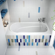 Biscuit-colored rectangular soaking bathtub with raised seat and rounded interior, installed in tiled alcove with chrome fixt