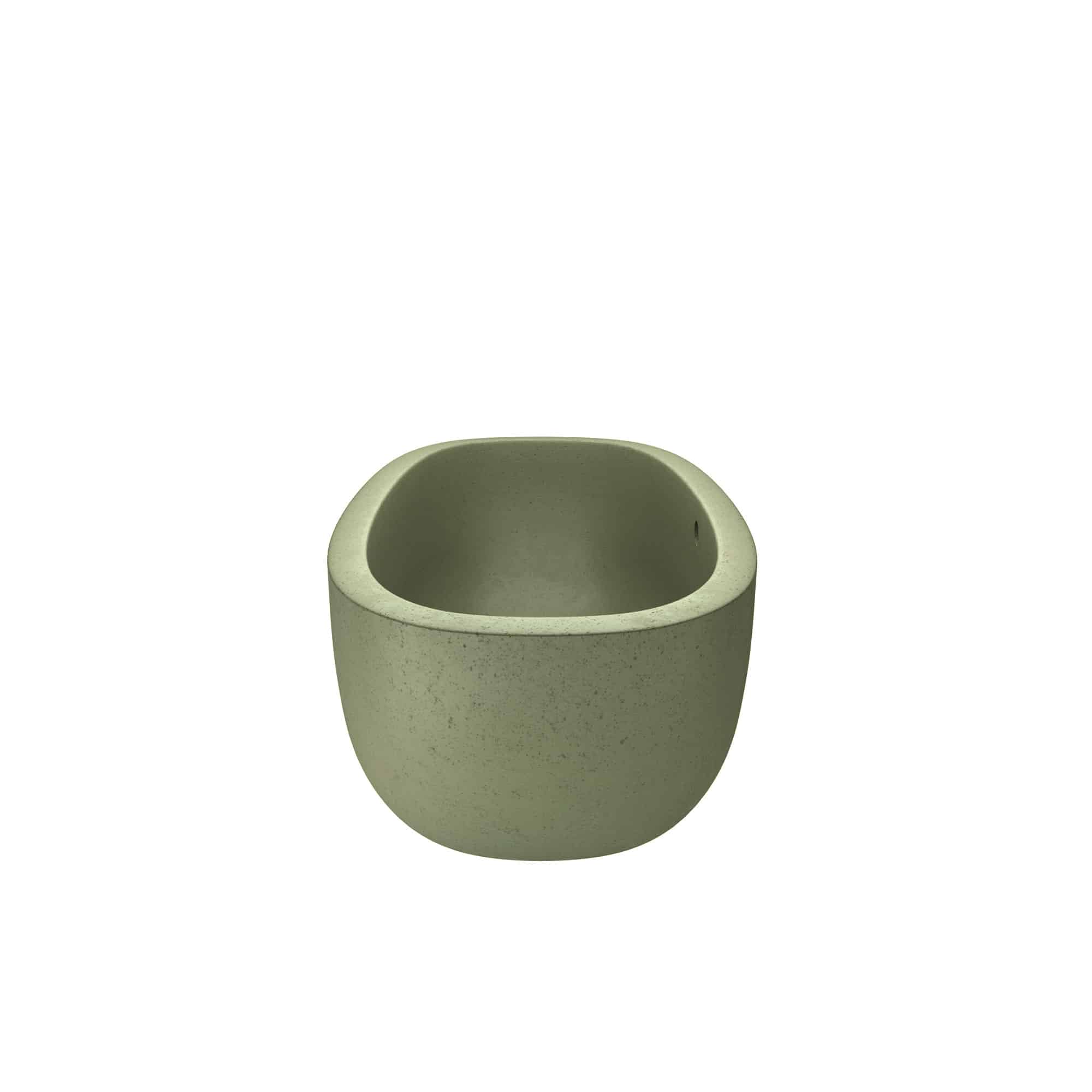 Sage green concrete bathroom sink with rounded bowl shape and speckled finish.