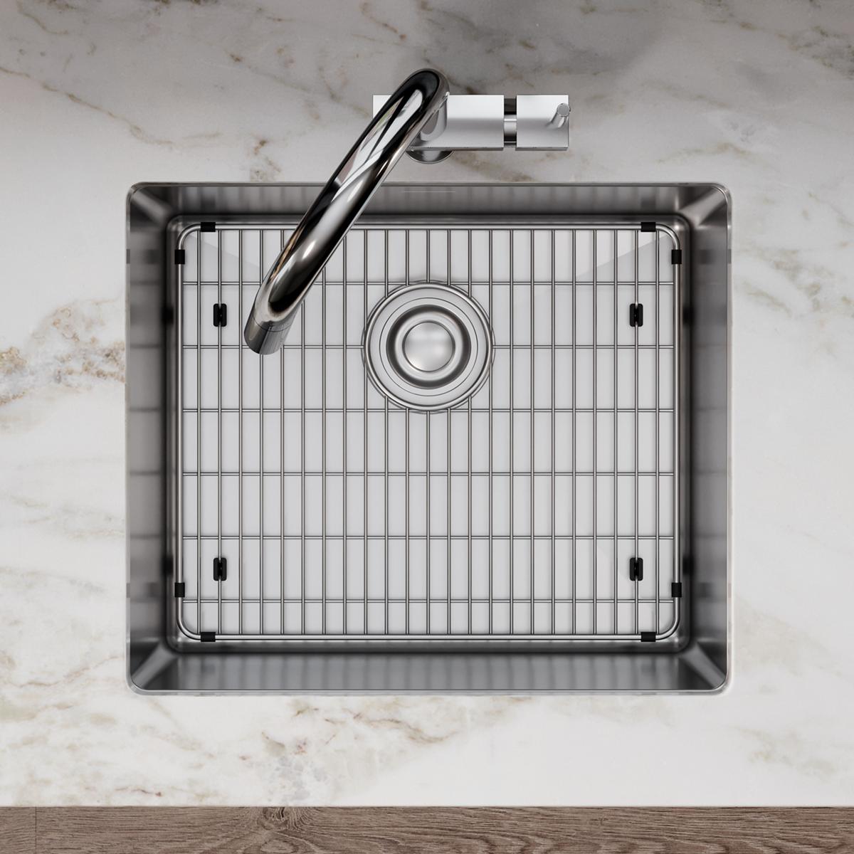 Stainless steel sink grid with vertical wire pattern and center drain hole, shown from above in a rectangular sink basin.