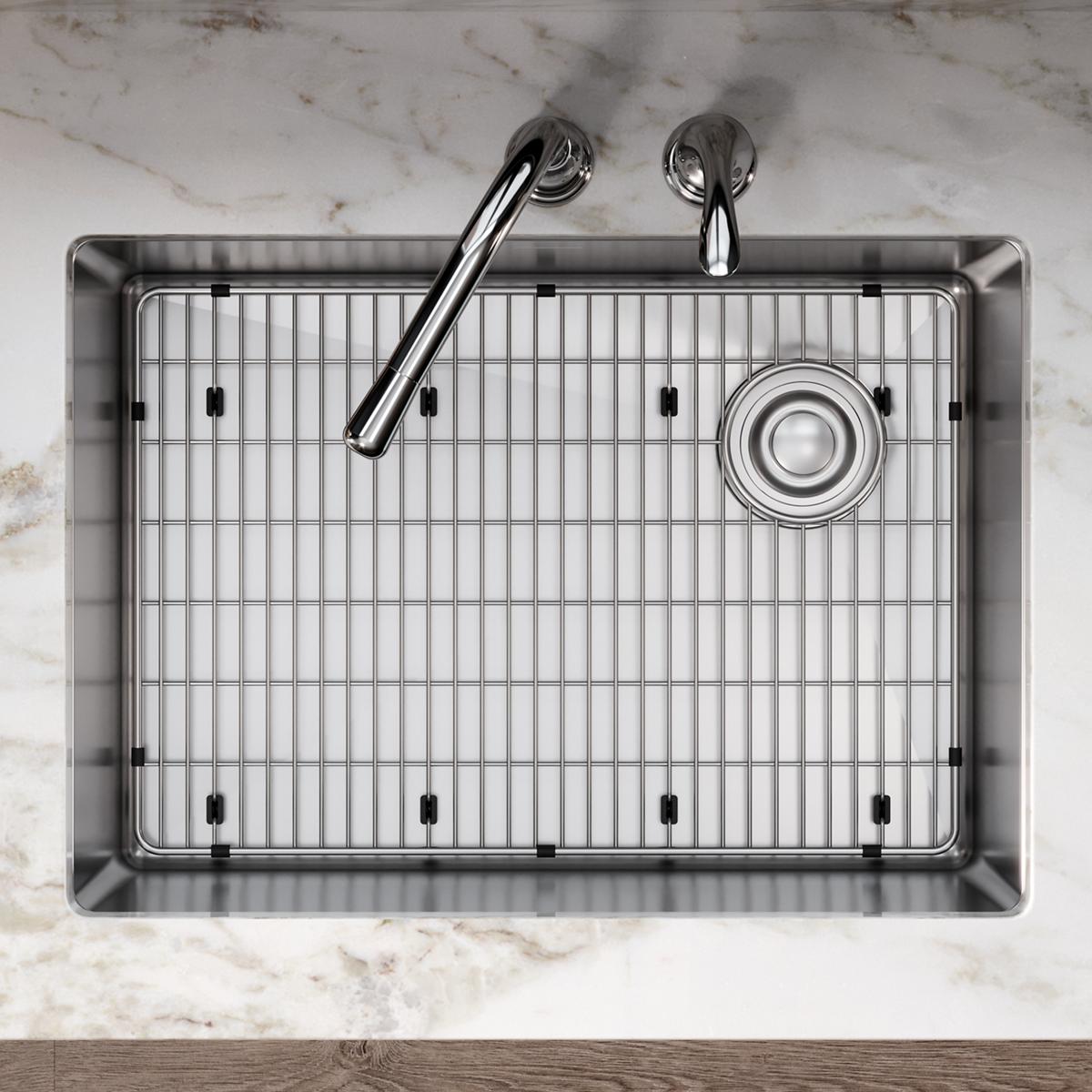 Stainless steel bottom grid with vertical bars and mounting feet for kitchen sink basin.
