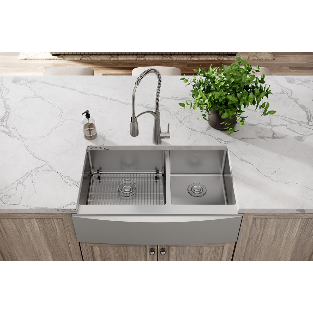 Stainless steel sink grid with horizontal ridged pattern for left basin of double-bowl farmhouse sink.