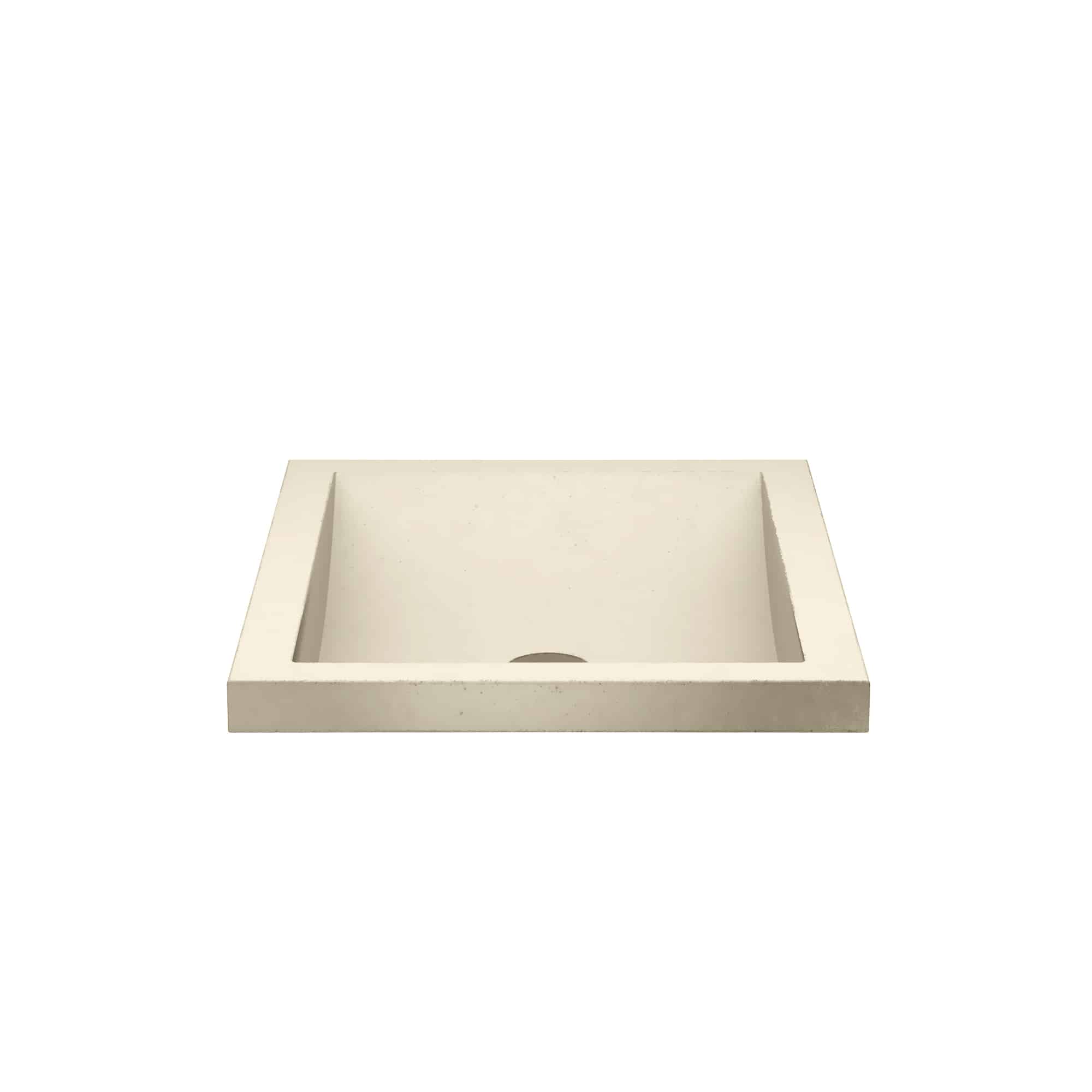Sand-colored rectangular concrete sink with single basin and drain hole.