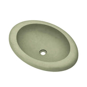 Sage-colored oval concrete sink with single drain hole and textured surface.