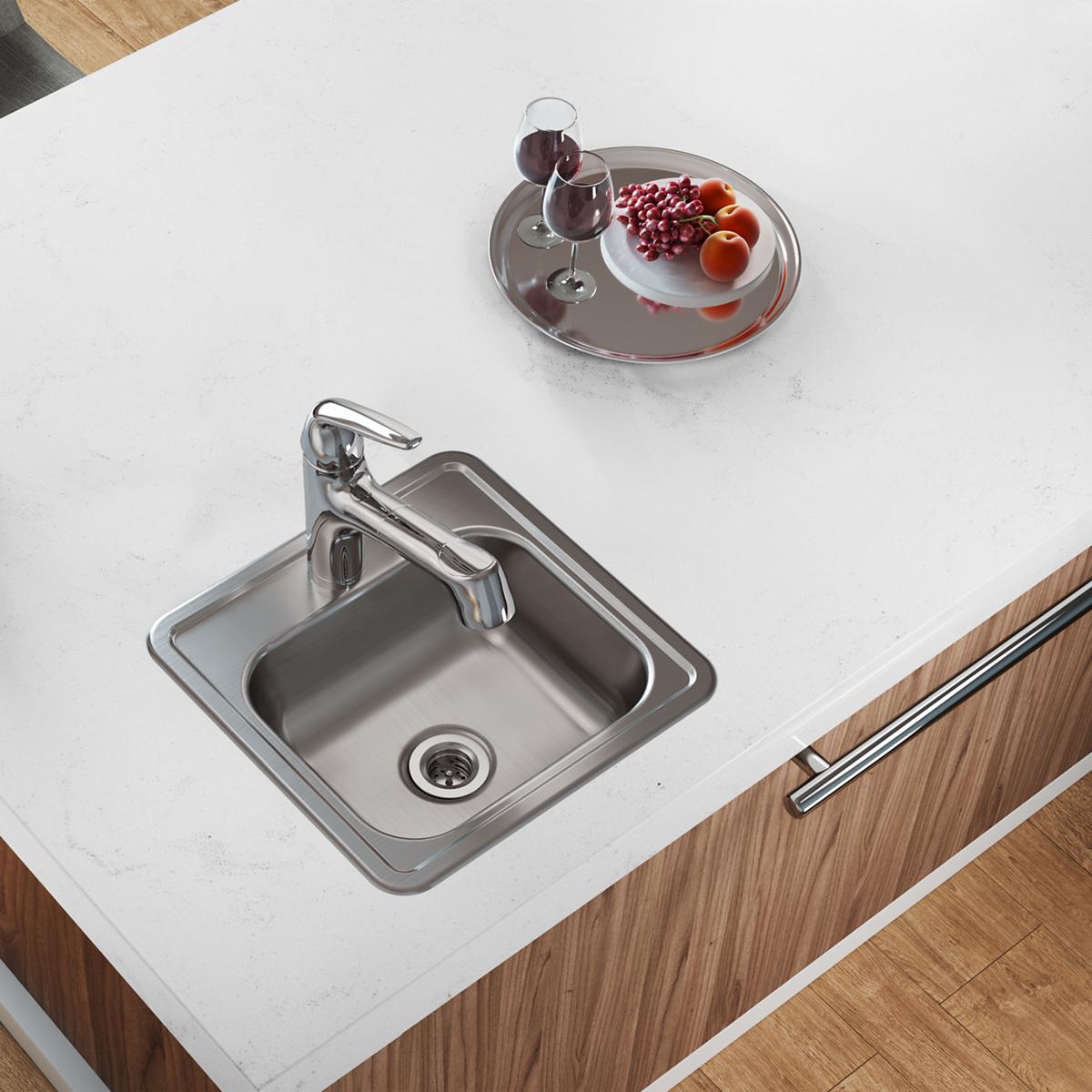 Stainless steel square drop-in bar sink with single bowl, chrome faucet, and 2-hole mounting installed in white countertop.