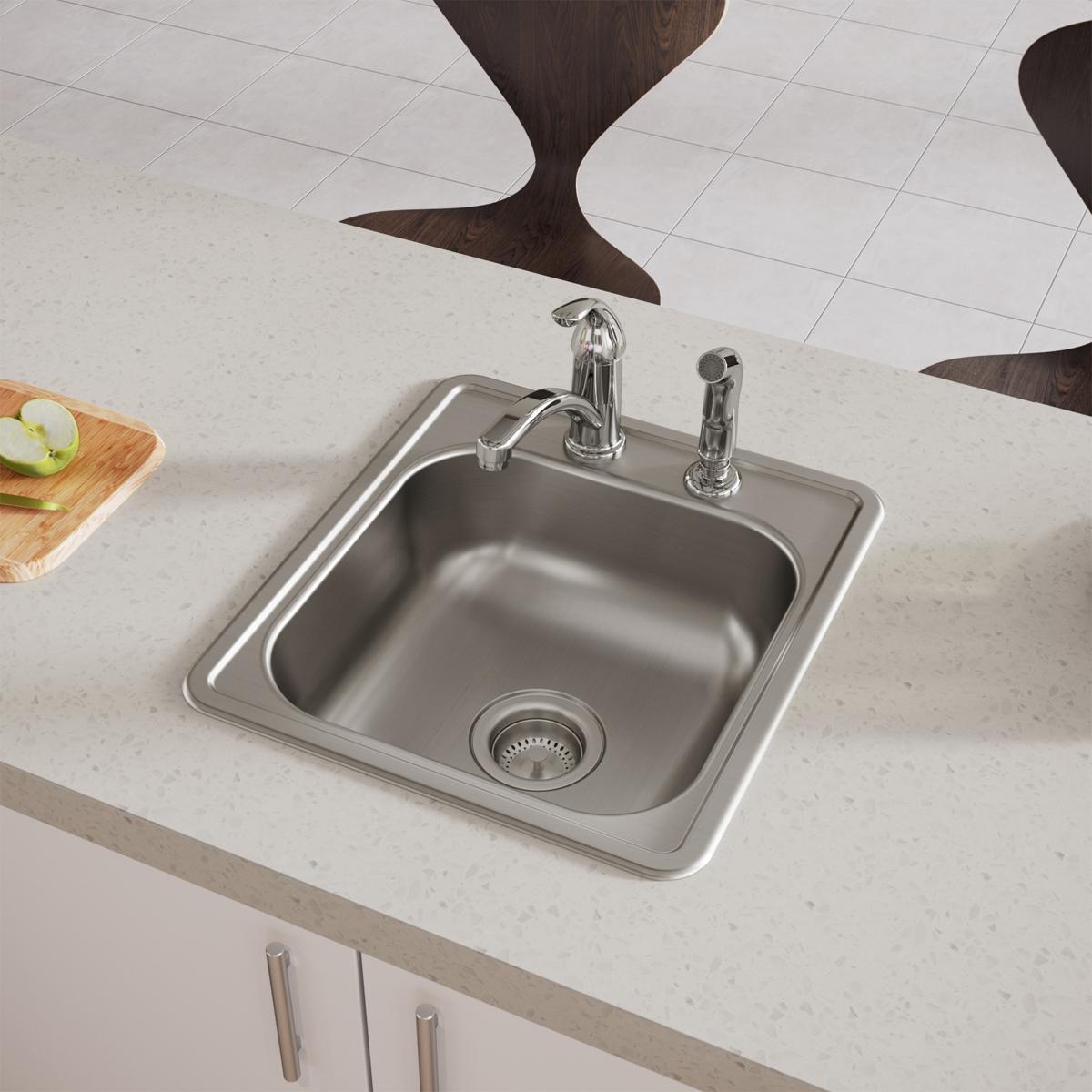 Stainless steel drop-in bar sink with single bowl, two faucet holes, and strainer drain installed in countertop.