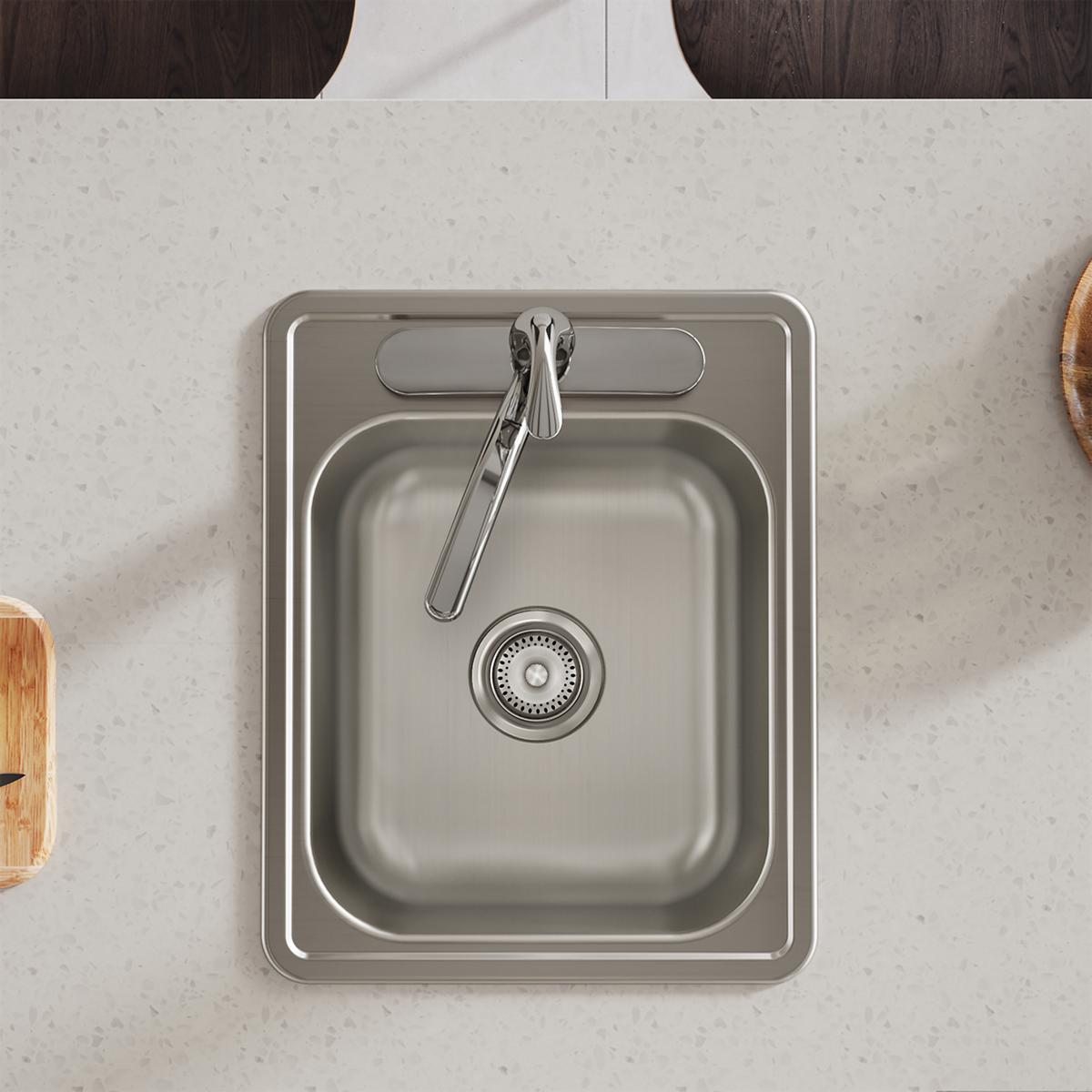 Stainless steel drop-in bar sink with single bowl, drain strainer, and three pre-drilled faucet holes, mounted in countertop.