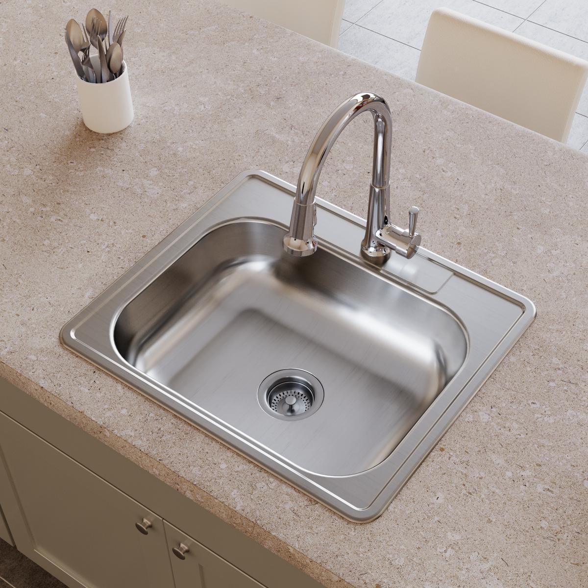 Stainless steel single bowl drop-in sink with two faucet holes and chrome pull-down faucet installed in countertop.