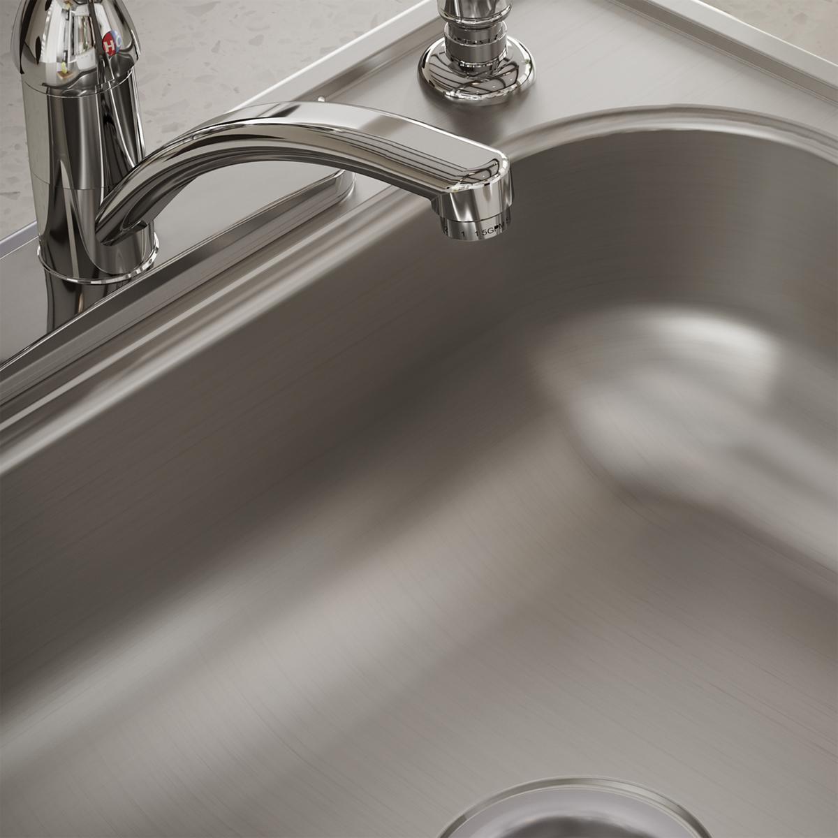 Stainless steel drop-in sink bowl with chrome faucet and four mounting holes visible on rim.