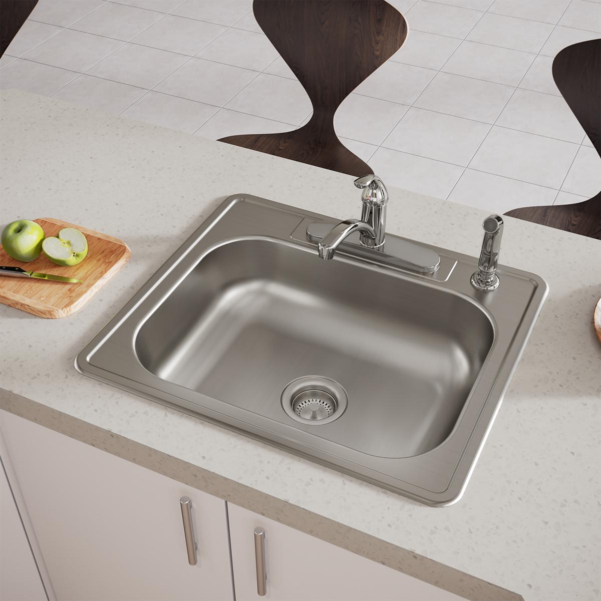 Stainless steel drop-in sink with single bowl, faucet, and four mounting holes installed in countertop.