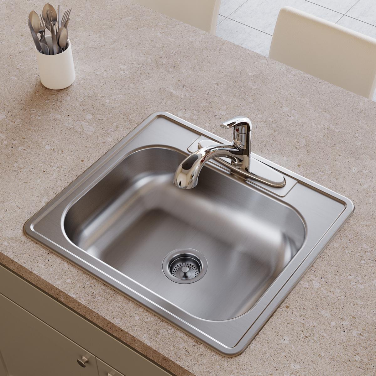 Stainless steel drop-in sink with single bowl, chrome faucet, and drain strainer installed in countertop.