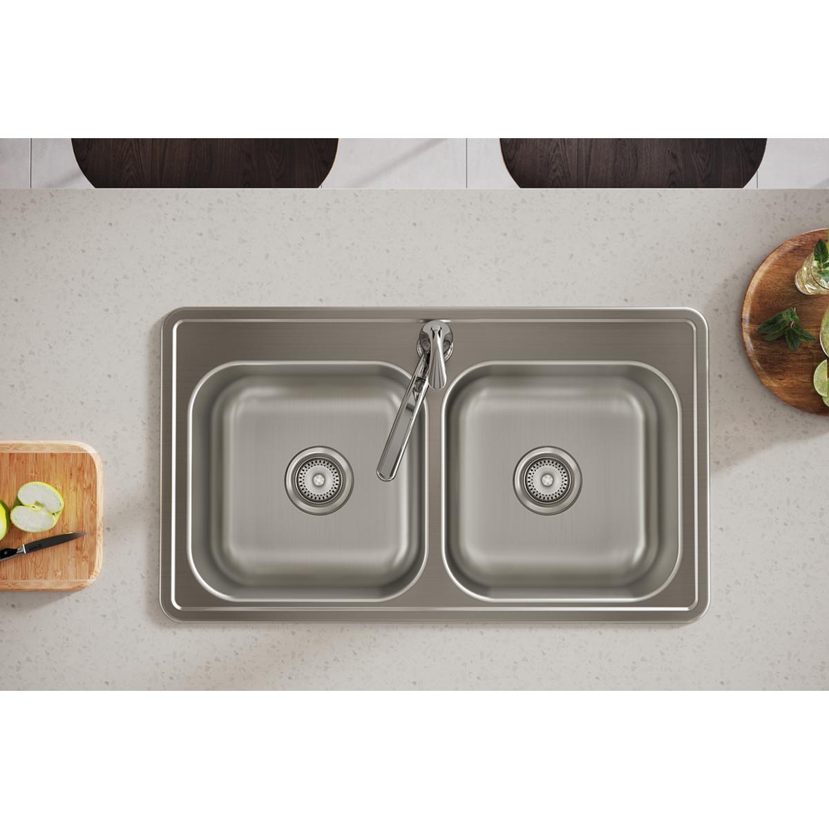 Stainless steel double bowl drop-in sink with two equal compartments and single faucet hole, viewed from above in countertop.