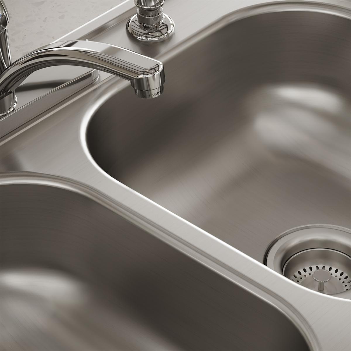 Stainless steel double bowl drop-in sink with faucet and drain strainer installed in countertop.