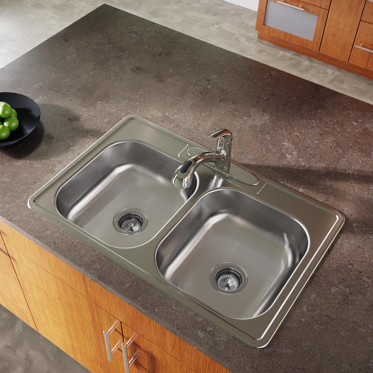 Stainless steel double bowl drop-in sink with two equal basins, drain strainers, and chrome faucet installed in countertop.