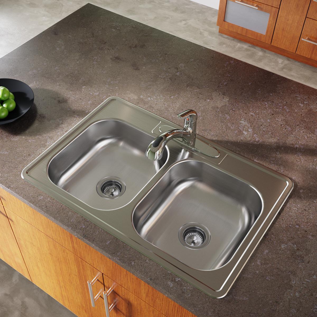 Stainless steel double bowl drop-in sink with two equal basins and chrome faucet installed in countertop.