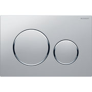 Matte chrome rectangular actuator plate with two circular flush buttons, larger on left and smaller on right.