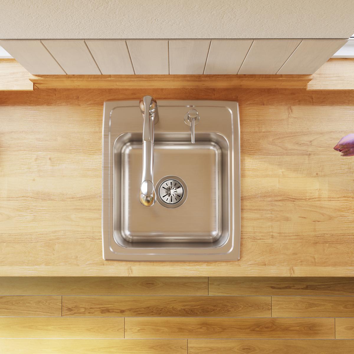 Stainless steel single bowl drop-in sink with one faucet hole, installed in wooden countertop, viewed from above.